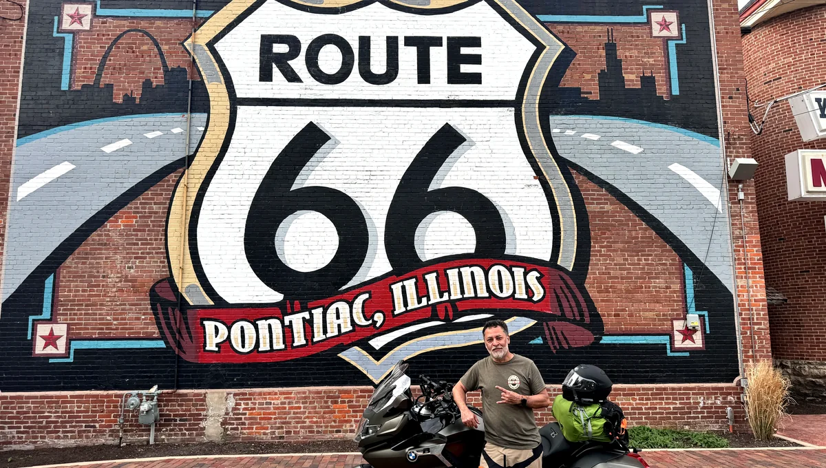 Rocke and motorcycle in front of a Route 66 mural in Pontiac, Illinois
